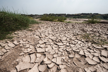 Dry ground surface crack texture, drought effect.