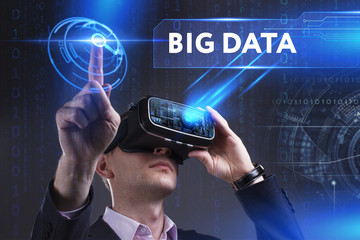 Business, Technology, Internet and network concept. Young businessman working in virtual reality glasses sees the inscription: Big data