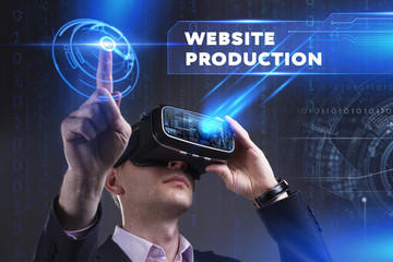 Business, Technology, Internet and network concept. Young businessman working in virtual reality glasses sees the inscription: Website production