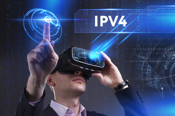 Business, Technology, Internet and network concept. Young businessman working in virtual reality glasses sees the inscription: IPv4