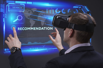 Business, Technology, Internet and network concept. Young businessman working on a virtual screen of the future and sees the inscription: Recommendation