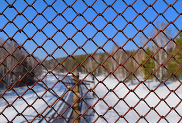 Rusted iron grid and Trans-Siberian Railway