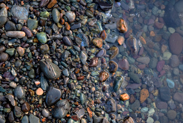 Pebbles on the shore of a mountain river