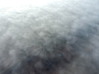 In the skies above the fog. Sunrise over the fog. Clouds near the ground
