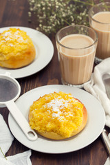 traditional portuguese bread pao de deus and coffee with milk