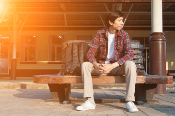 Man in train station waiting to travel,selective focus.