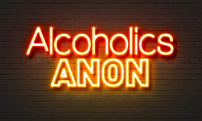 Alcoholics anon neon sign on brick wall background.