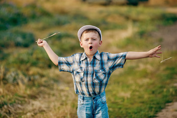 Young boy playing in the fields in rural areas.