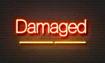 Obraz premium Damaged neon sign on brick wall background.