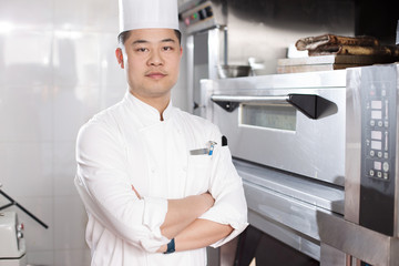young man chelf in modern kitchen