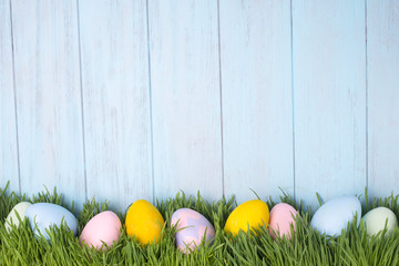 Fototapeta premium decorated easter eggs in the grass