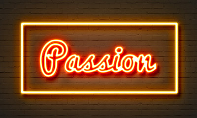 Obraz premium Passion neon sign on brick wall background.