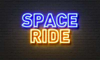 Obraz premium Space ride neon sign on brick wall background.