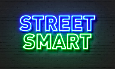 Street smart neon sign on brick wall background.