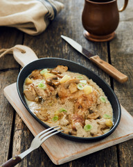 Chicken leg with mushrooms and apple cream