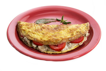 Omelet on a colored plate over white background