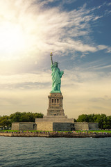 Obraz premium Statue of Liberty on Liberty Island with lens flare, New York City, USA