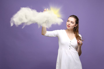 Woman with cloud and sun. Concept on the topic of computer cloud services.