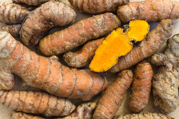 Fresh turmeric roots and one slice