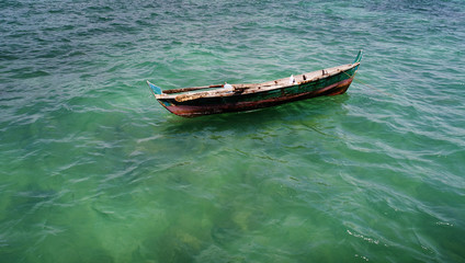 Fototapeta premium Aerial view of fisherman boat floating on the sea
