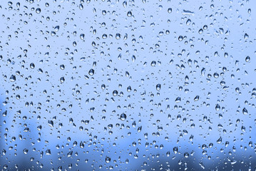 Water drops background. Water drops on glass window in rainy day.