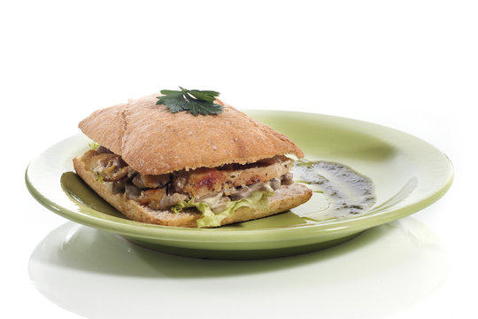 Healthy Chicken And Mushroom Sandwich On Green Plate Over White Background