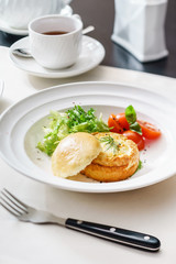 eggs benedict with fresh salad