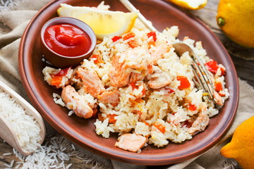 Rice pilaf with salmon, lemon and red pepper