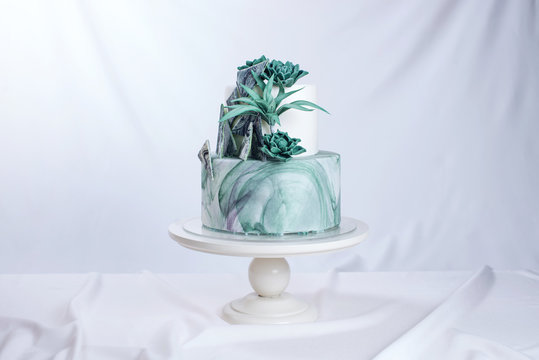 Wedding Cake Decorated Like A Stone Marble With Green Flowers