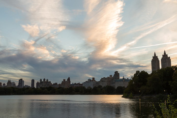 Dramatic sunset sky over the Upper West Side from the Jacqueline Kennedy Reservoir in Central Park, New York