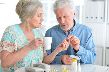 Elderly couple with pills