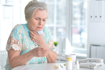 Sick elderly woman with medication