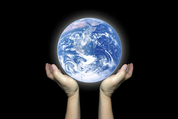 Two Hands hold the beautiful shining earth.