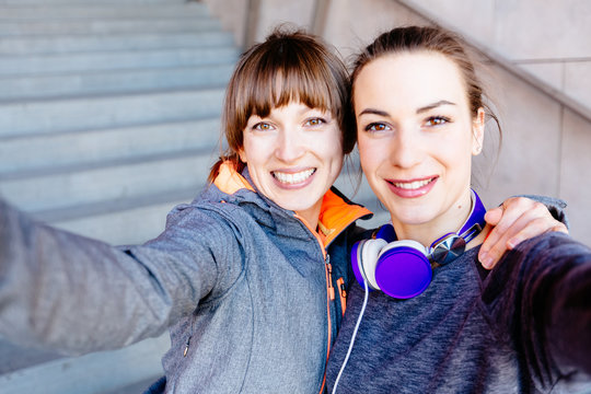 Two Sporty Women Face To Face Doing Selfie After Marathon Or Workout Fitness.