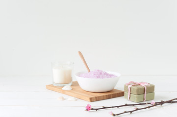 Spa products on light wooden background