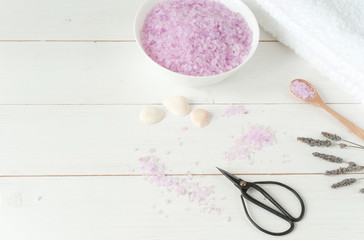 Spa products on light wooden background