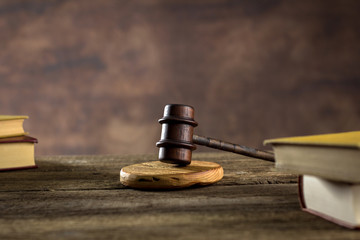 Obraz na płótnie Canvas Law theme, mallet of judge, wooden gavel, books