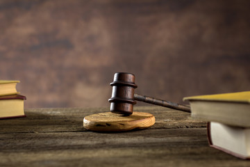 Law theme, mallet of judge, wooden gavel, books