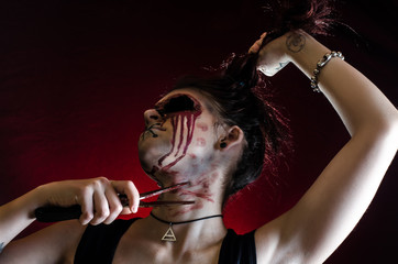 crazy girl with scissors in the blood halloween