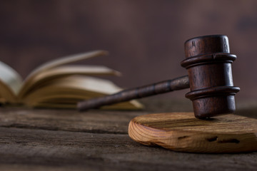 Law theme, mallet of judge, wooden gavel, books