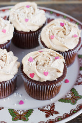 Chocolate cupcakes decorated with cream rose hearts
