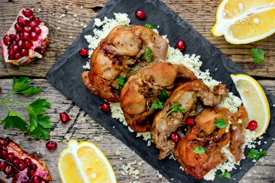 Rabbit with couscous lemon and pomegranate in oriental style
