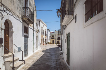 Fototapeta na wymiar Old narrow street in southern Italy, Puglia.