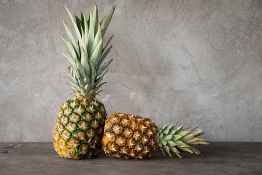 Ripe pineapples on a wooden table