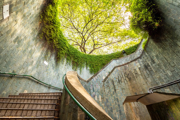 Spiral staircase of underground crossing in tunnel at Fort Canning Park, Singapore