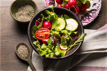 Fresh salad  tomatoes and mixed greens (arugula, mesclun, mache