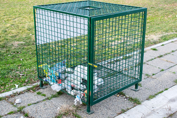 Gray recycle bin, trash bin in the park