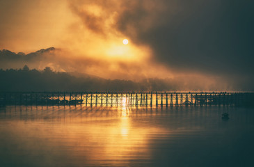 Morning light Mon Bridge in Kanchanaburi. silhouette.