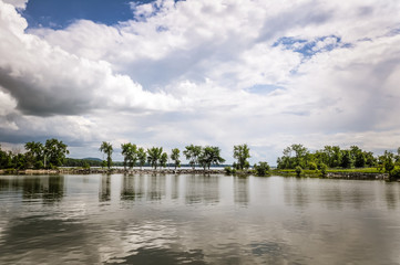 Obraz premium Water, trees and cloud on Lake champlain