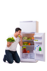 Man next to fridge full of food